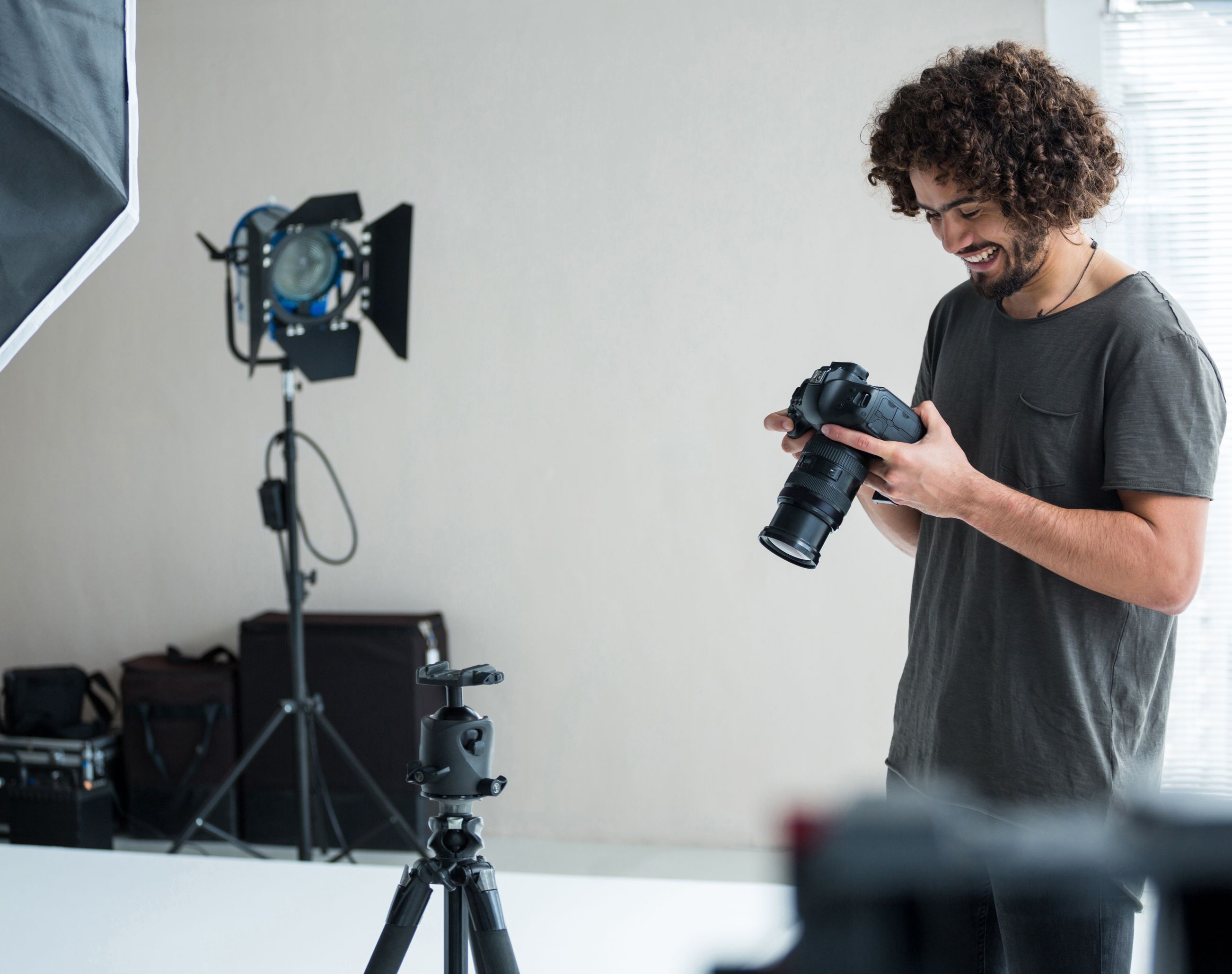 VKTWA Photographer smiling while checking his camera.